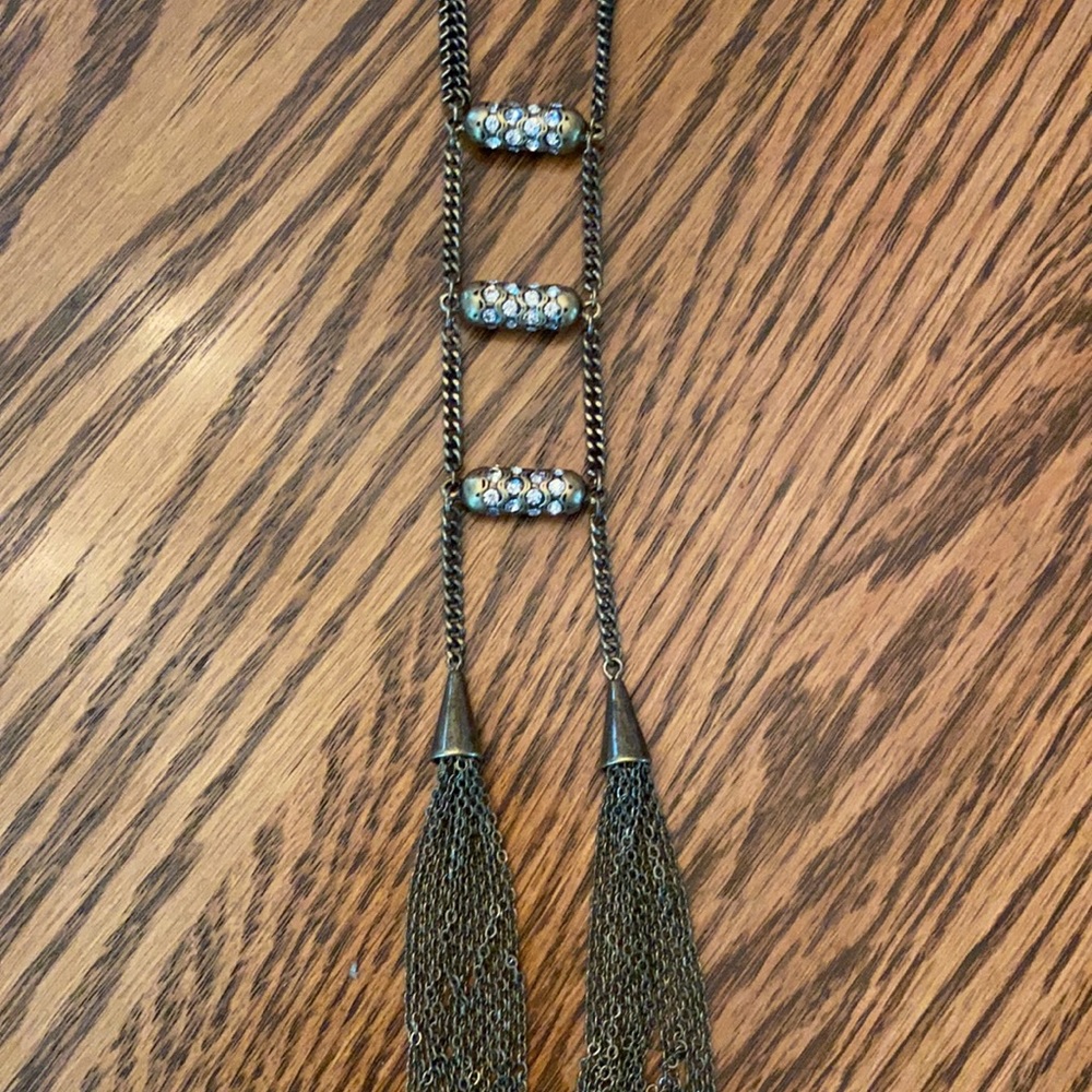 Unique-Antiqued gold tone long necklace.